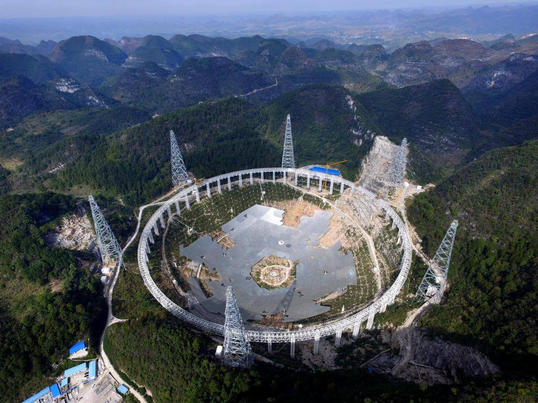 epa05164317 A picture made available 16 February 2016 shows the Five-hundred-meter Aperture Spherical radio Telescope (FAST) under construction in the remote Pingtang county in southwest China's Guizhou province, 26 November 2015. The project, one of China's nine most important scientific research facilities, will be the world's largest radio telescope upon completion by September 2016.  EPA/STR CHINA OUT